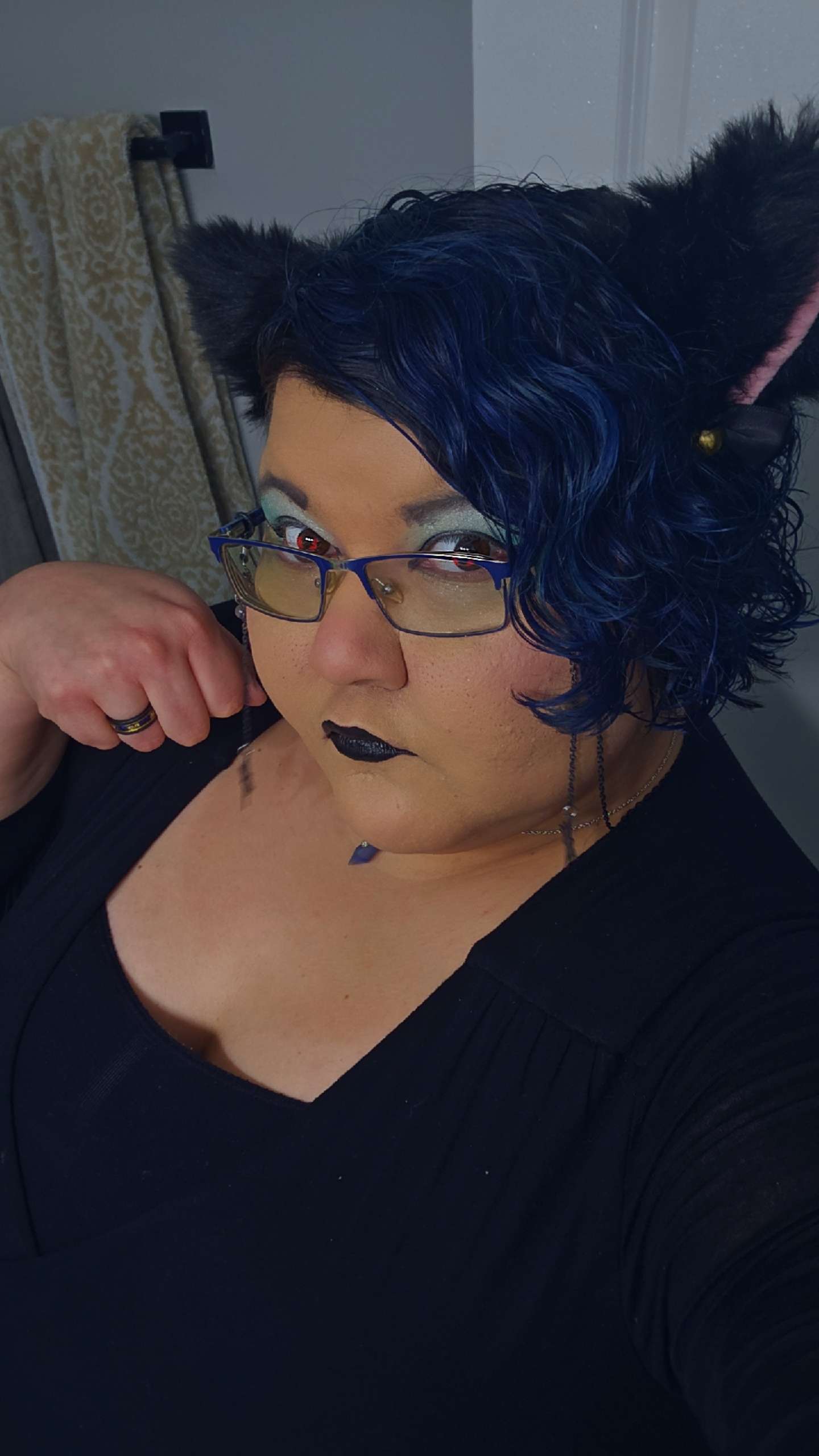 Portrait of Esme with cat ears.
